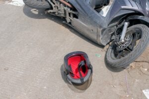A crashed motorcycle and helmet on the ground. What is the statute of limitations for motorcycle accident lawsuits in Texas?